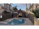 Beautiful community pool with a charming stone pool house and palm trees at 1505 Couples St, Las Vegas, NV 89128