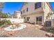 Well-maintained backyard with rock cover, a concrete patio, and outdoor seating at 1634 Clint Canyon Dr, Henderson, NV 89002