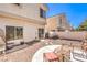 Cozy backyard featuring a concrete patio, gravel, and comfortable seating area at 1634 Clint Canyon Dr, Henderson, NV 89002