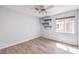 Empty bedroom featuring vinyl floors, neutral walls, a ceiling fan, and a window for natural light at 1634 Clint Canyon Dr, Henderson, NV 89002