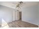 Empty bedroom featuring vinyl floors, neutral walls, a ceiling fan, closet and a doorway at 1634 Clint Canyon Dr, Henderson, NV 89002
