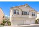 Three-story exterior elevation with attached multi-car garage and sidewalk at 1634 Clint Canyon Dr, Henderson, NV 89002