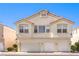 Three-story exterior elevation featuring multi-car garage and desert landscaping at 1634 Clint Canyon Dr, Henderson, NV 89002