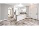 Open floor plan showcases kitchen with granite counters and a breakfast bar at 1634 Clint Canyon Dr, Henderson, NV 89002