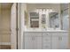 Contemporary bathroom offers double vanity with mirrors and closet space at 2033 Shining Feather Ln, Las Vegas, NV 89134