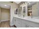 Bright bathroom features double sinks, white cabinets, and a walk-in closet at 2033 Shining Feather Ln, Las Vegas, NV 89134