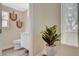 This half bathroom is decorated with modern fixtures and a plant at 2033 Shining Feather Ln, Las Vegas, NV 89134