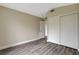 Cozy bedroom features wood-look floors and a spacious closet at 2033 Shining Feather Ln, Las Vegas, NV 89134
