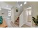 Open entryway featuring stairs, art, and wood-look flooring at 2033 Shining Feather Ln, Las Vegas, NV 89134