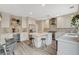 Modern kitchen with stainless steel appliances, white countertops, and a center island with seating at 2033 Shining Feather Ln, Las Vegas, NV 89134