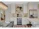 Well lit kitchen bar with a wine fridge and modern decorations at 2033 Shining Feather Ln, Las Vegas, NV 89134