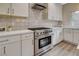 Bright kitchen with stainless oven range, light countertops, and decorative backsplash at 2033 Shining Feather Ln, Las Vegas, NV 89134