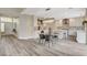 Spacious open floor plan showcasing a modern kitchen and dining area with lots of light at 2033 Shining Feather Ln, Las Vegas, NV 89134