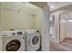 Convenient laundry room with washer, dryer, and easy access to other rooms at 2033 Shining Feather Ln, Las Vegas, NV 89134