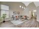 Airy living room boasting high ceilings, large windows, and modern decor with a comfortable sectional sofa and stylish accents at 2033 Shining Feather Ln, Las Vegas, NV 89134