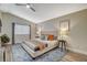 Bedroom featuring neutral paint colors, ceiling fan, ensuite bath, and wood-look flooring at 2033 Shining Feather Ln, Las Vegas, NV 89134