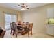 Bright dining room with wood table and chairs near sliding glass door at 2142 Oliver Springs St, Henderson, NV 89052