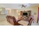 Comfortable living room with leather sofas, entertainment center, and neutral color palette at 2142 Oliver Springs St, Henderson, NV 89052