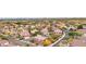Aesthetic aerial view of homes nestled among green trees and well maintained lawns at 2337 Ivory Point Ct, Las Vegas, NV 89134