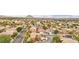 Expansive aerial view of a residential neighborhood with mountain views, featuring well-maintained homes and lush landscaping at 2337 Ivory Point Ct, Las Vegas, NV 89134