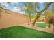 Well landscaped backyard featuring desert foliage and a stucco exterior elevation at 2337 Ivory Point Ct, Las Vegas, NV 89134