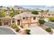 Stunning two-story home with a three-car garage and beautifully landscaped yard at 2337 Ivory Point Ct, Las Vegas, NV 89134