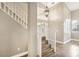 Bright foyer with wood floors, white trim, and a staircase with modern lighting at 2337 Ivory Point Ct, Las Vegas, NV 89134
