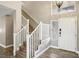 Bright foyer with wood floors, white trim, and a staircase at 2337 Ivory Point Ct, Las Vegas, NV 89134