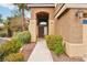 Front entrance to stucco house with well-kept landscaping at 2337 Ivory Point Ct, Las Vegas, NV 89134