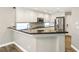 Modern kitchen with granite countertops, white cabinets, and stainless steel appliances at 2337 Ivory Point Ct, Las Vegas, NV 89134