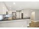 Stylish kitchen featuring granite counters, stainless steel appliances, and white cabinetry at 2337 Ivory Point Ct, Las Vegas, NV 89134