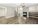 Cozy living room features wood flooring, a fireplace, and stairway access at 2337 Ivory Point Ct, Las Vegas, NV 89134