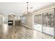 Well-lit living area features fireplace, wood floors, and sliding doors to the outdoor pool at 2337 Ivory Point Ct, Las Vegas, NV 89134