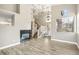Living room with wood floors, fireplace and staircase at 2337 Ivory Point Ct, Las Vegas, NV 89134