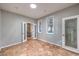 Bedroom featuring hard surface floors, decorative windows, and light-colored walls at 2413 Hamonah Dr, Henderson, NV 89044