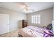 Bedroom featuring a ceiling fan, shuttered window, closet, and hard surface floors at 2413 Hamonah Dr, Henderson, NV 89044