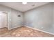 Empty bedroom with neutral walls, tile flooring, and ample natural light at 2413 Hamonah Dr, Henderson, NV 89044