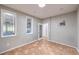 Bedroom with tiled floors, an art decor window and a door leading to another room at 2413 Hamonah Dr, Henderson, NV 89044