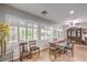 Sunlit dining area showcases plantation shutters and an elegant hutch for ample storage and display at 2413 Hamonah Dr, Henderson, NV 89044