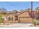 Inviting single-story residence with a neatly maintained front yard and attached garage at 2413 Hamonah Dr, Henderson, NV 89044