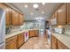 Expansive kitchen with ample counter space, stainless appliances, and a view to the backyard at 2413 Hamonah Dr, Henderson, NV 89044
