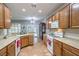 Spacious kitchen with lots of counter space, oak cabinets, and tile flooring throughout at 2413 Hamonah Dr, Henderson, NV 89044