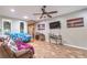 Spacious living room with tile floors, recessed lighting, and modern wall decor at 2413 Hamonah Dr, Henderson, NV 89044