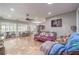 Open living area with tile floors, ceiling fan, and windows with plantation shutters at 2413 Hamonah Dr, Henderson, NV 89044