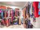 Spacious walk-in closet with ample hanging space and shelves for storing clothing and accessories at 2413 Hamonah Dr, Henderson, NV 89044