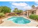 Inviting backyard pool with a covered patio, ideal for swimming and lounging in a tranquil setting at 2810 Lava Rock Ave, North Las Vegas, NV 89031