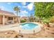Beautiful backyard with a pool, covered patio, and well-maintained landscaping, perfect for relaxation and outdoor gatherings at 2810 Lava Rock Ave, North Las Vegas, NV 89031