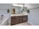 Stylish bathroom featuring a double sink vanity, bathtub and neutral decor at 2810 Lava Rock Ave, North Las Vegas, NV 89031