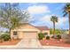 Charming single-story home featuring a well-maintained yard, two-car garage, and mature trees at 2810 Lava Rock Ave, North Las Vegas, NV 89031