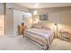 Inviting main bedroom featuring soft carpeting and a soothing, neutral color palette at 2810 Lava Rock Ave, North Las Vegas, NV 89031